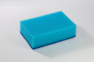Sponge. Blue sponge. Side view. Sponge on a white background.