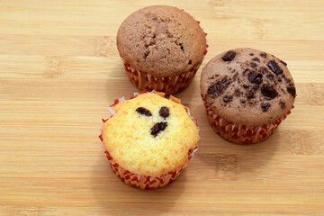 Delicious homemade vanilla muffin with raisins and cocoa muffins
