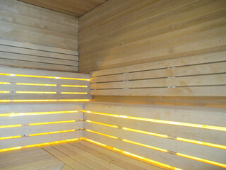 Finnish or dry sauna with oceanview or view of the sea inside male locker room of spa or wellness...