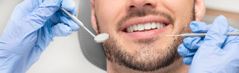 Man having teeth examined at dentists