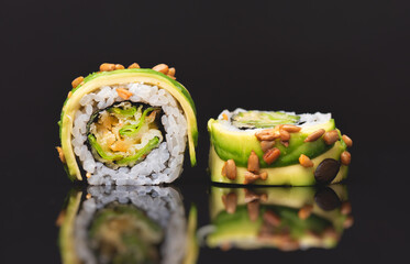 Sushi roll set on black glass background