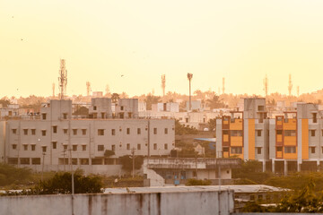 A low rise Chennai cityscape during the golden hour