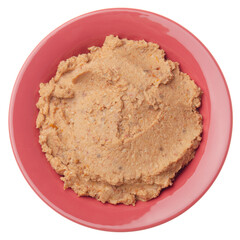 Flat lay view at hummus - spread made from cooked, mashed chickpeas blended with tahini, lemon juice, garlic and dried tomatoes isolated on white background