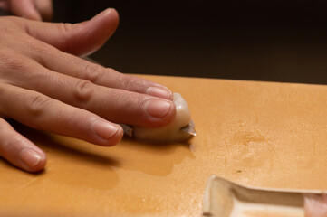 Making Japanese food with hands, raw fish sushi with fish eggs