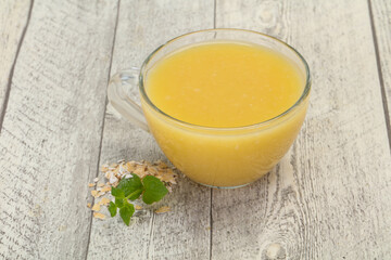 Dietary vegetarian oats milk over wooden