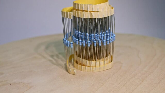 close up group of electronic resistor components on a white background