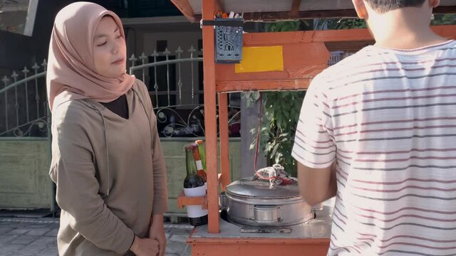 man selling bakso in the carts. indonesia street food. small business entrepreneur