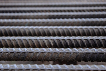 Rebar, known when massed as reinforcing steel or reinforcement steel. Steel reinforcement bars or rods used to reinforce concrete