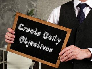 Motivation concept about Create Daily Objectives with inscription on the page.