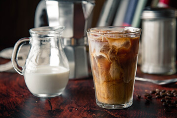 iced coffe with milk and book cafe background
