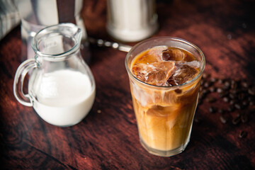 iced coffe with milk and book cafe background