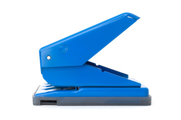 Blue two hole punch isolated on white background. Office stationery item. Close up.