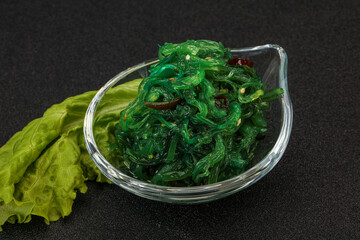 Green Chuka Seaweed Salad Isolated on White Background Top View. Wakame Sea Kelp Salat