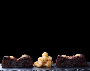 Chocolate brownies with sesame balls or Klepon, Kelepon, Onde Onde- traditional Southeast Asian rice cake balls. Asian modern dessert