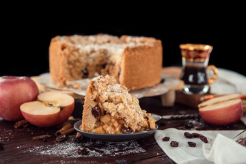 Homemade delicious apple pie with different ingredients on rustic background. Classic autumn Thanksgiving dessert - organic apple pie.