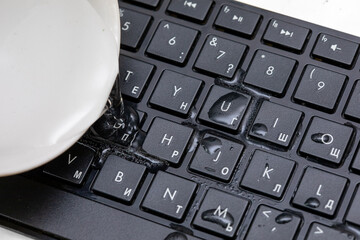 drops of water on a black keyboard