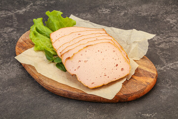 Boiled pork sausage over board