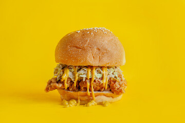 Chicken burger with yellow background