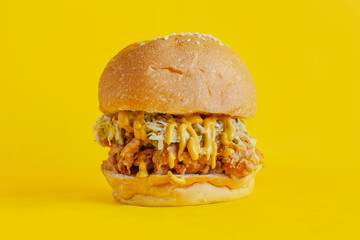 Chicken burger with yellow background