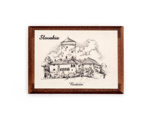 Magnetic souvenir from Slovakia isolated on white background. The inscription on the Slovak language is the name of the castle "Budatin" in English