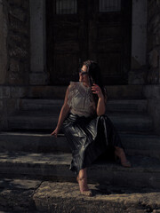 Woman sitting on the stone steps