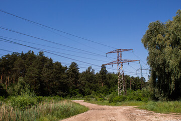Obraz premium high voltage power lines in the forest