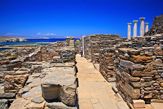 Walking around the ancient town in the archaeological site of the "sacred" island of Delos. Cyclades, Aegean sea, Greece.