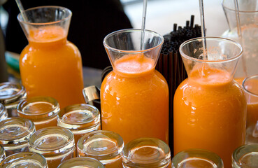 carrot juice in glass jugs