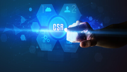 Hand touching CSR inscription, new technology concept