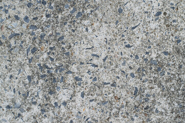 Close-up surface texture of old concrete floor with stone for background.