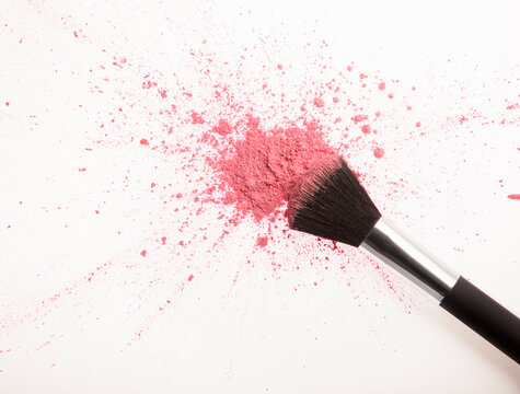 Makeup Brush And Pink Blush Powder Splatter