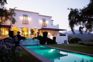 Fototapeta na wymiar Luxury lap pool and villa at dusk