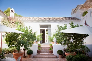 Foto op Canvas Doorway from patio into Spanish villa © Martin Barraud/KOTO