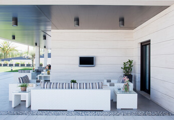 Sofa and television on luxury patio - obrazy, fototapety, plakaty