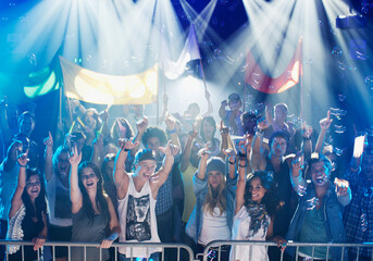 Portrait of enthusiastic crowd at concert