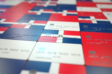 National flag of the Dominican Republic on credit cards. Banking related 3D rendering