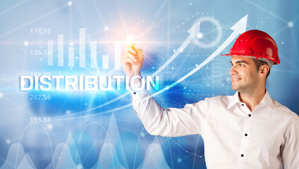 Young businessman with helmet drawing DISTRIBUTION inscription, modern business technology concept