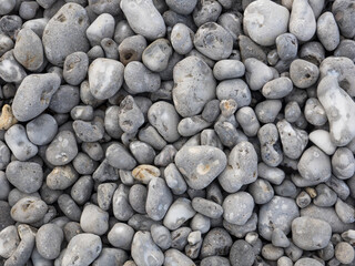 Small rock pebble bottom naturally polished by the sea.