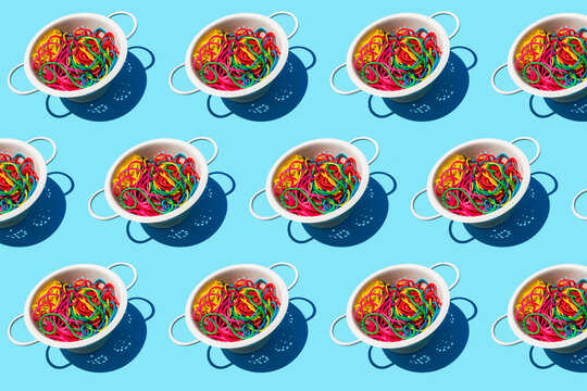 Pattern of colanders with colorful pasta