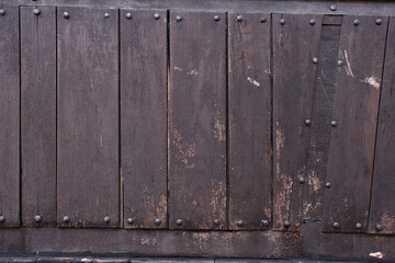 Old wooden cladding of ship as background.