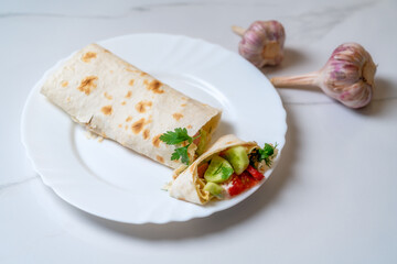 roll with tomatoes, cucumbers, garlic and herbs