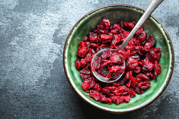 dried cranberries dried berries cherry sweet and healthy treat Menu concept serving size. food background top view copy space for text organic healthy eating
