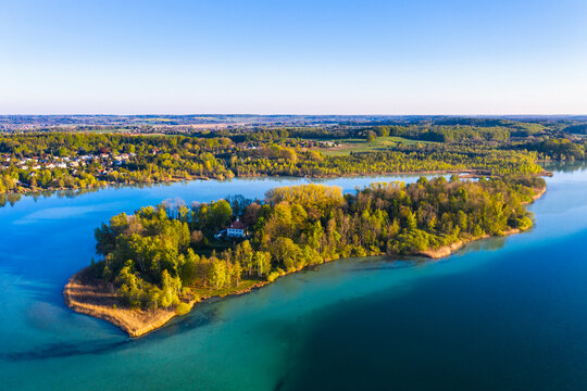 Germany, Bavaria, Inning am Ammersee, Drone view of clear sky over forested shore of Worth island