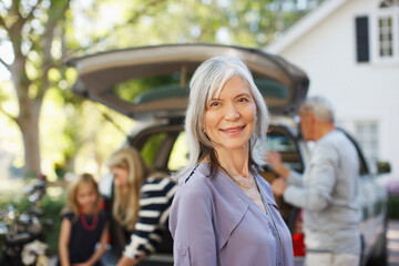 Older woman smiling outdoors