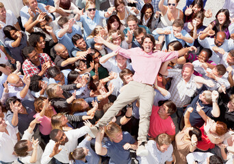 Portrait of enthusiastic man crowd surfing