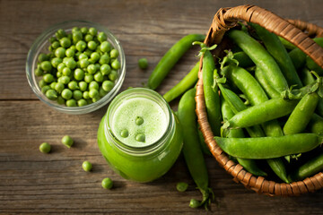 fresh paste of ripe green peas on a wooden table