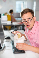 Fototapeta na wymiar Businessman eating Chinese food at desk