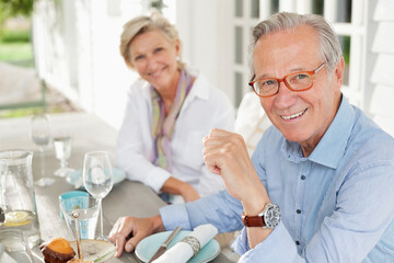 Couple smiling at table together