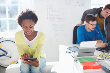 Businesswoman using digital tablet in office