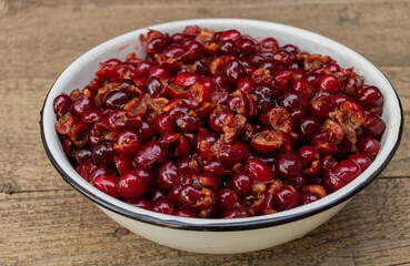 Cherries with seeds removed, in the process of cooking cherry jam